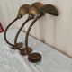Trio of wall lamps Christopher Wray applies articulated lamp shell