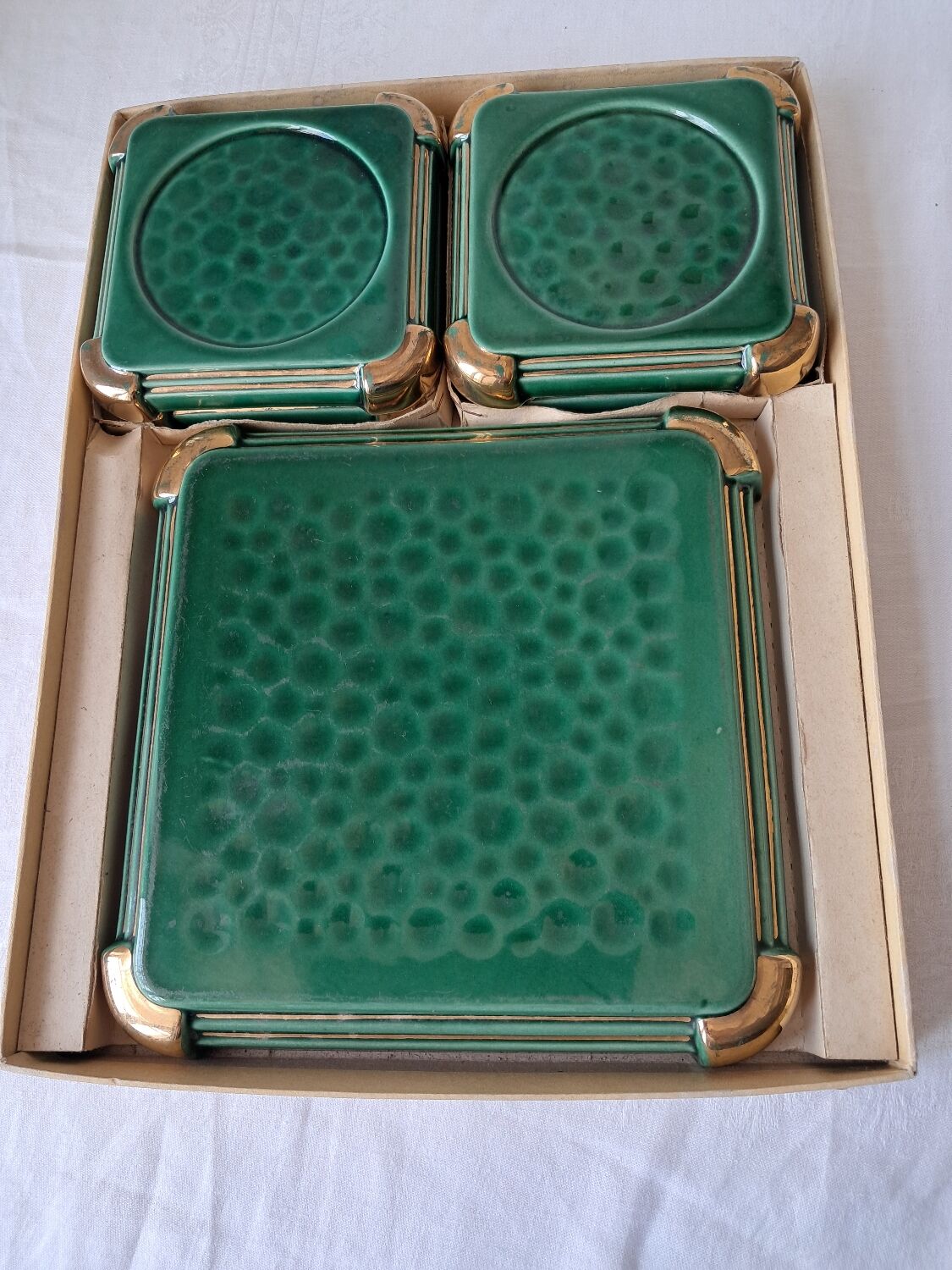Ceramic trivets and glasses from Poët-Laval. Vintage