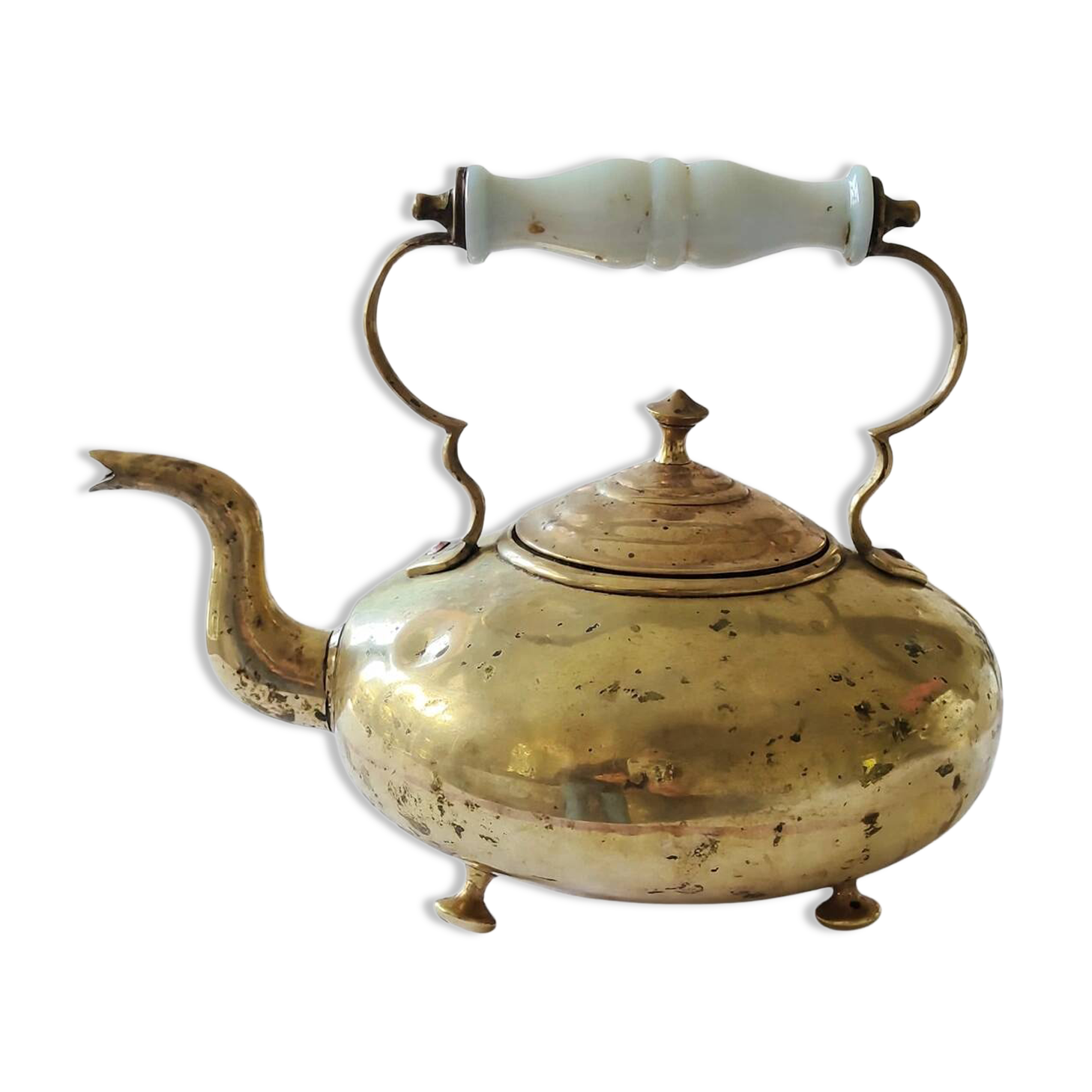 Victorian tripod kettle made of brass with a porcelain handle.