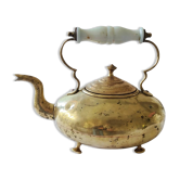 Victorian antique brass kettle with three feet and porcelain handle.