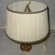 Empire style lamp in golden brass with pleated shade