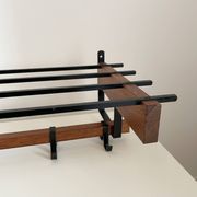 Vintage Scandinavian wall coat rack in wood and metal.