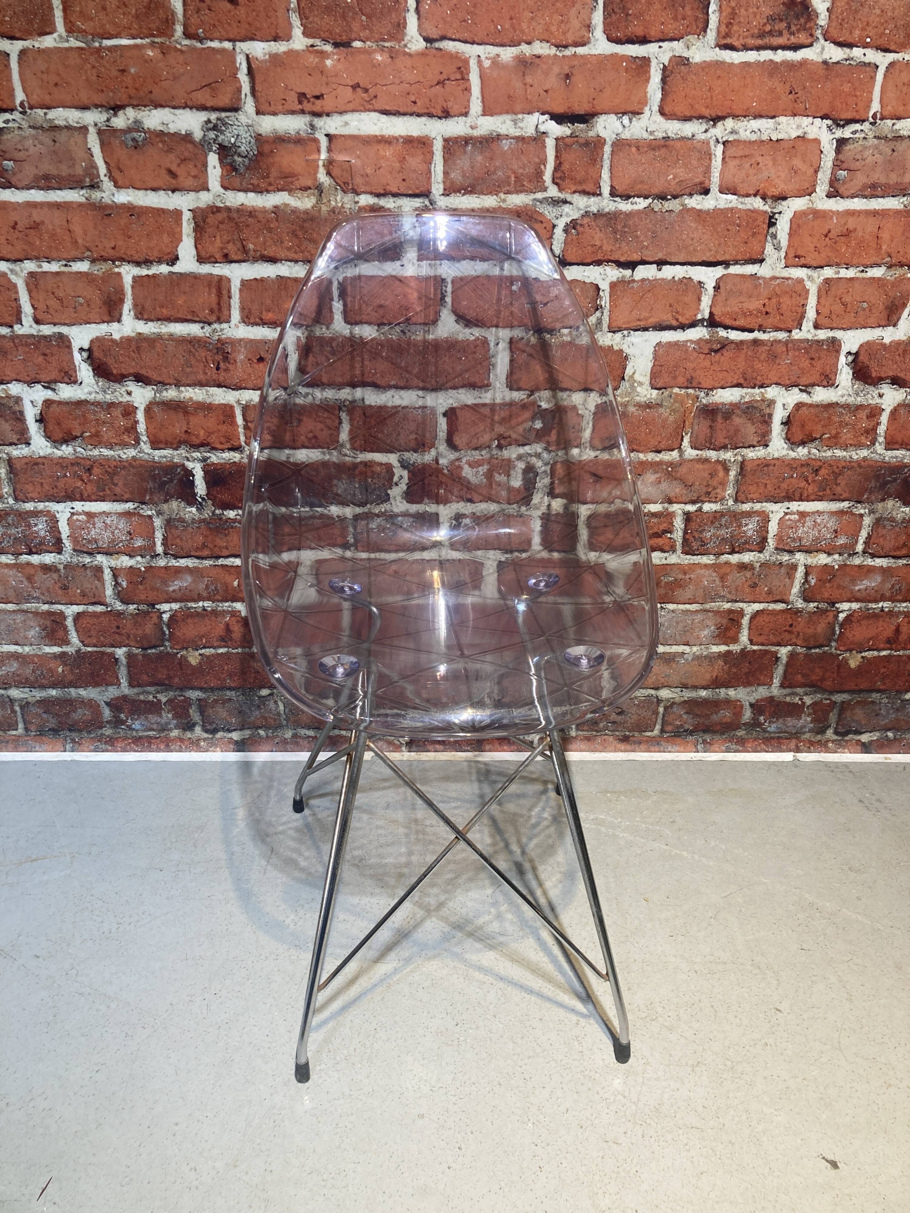 Set of four plexiglass and metal chairs