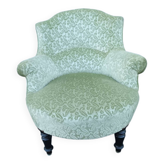 Old green fabric fireside chair