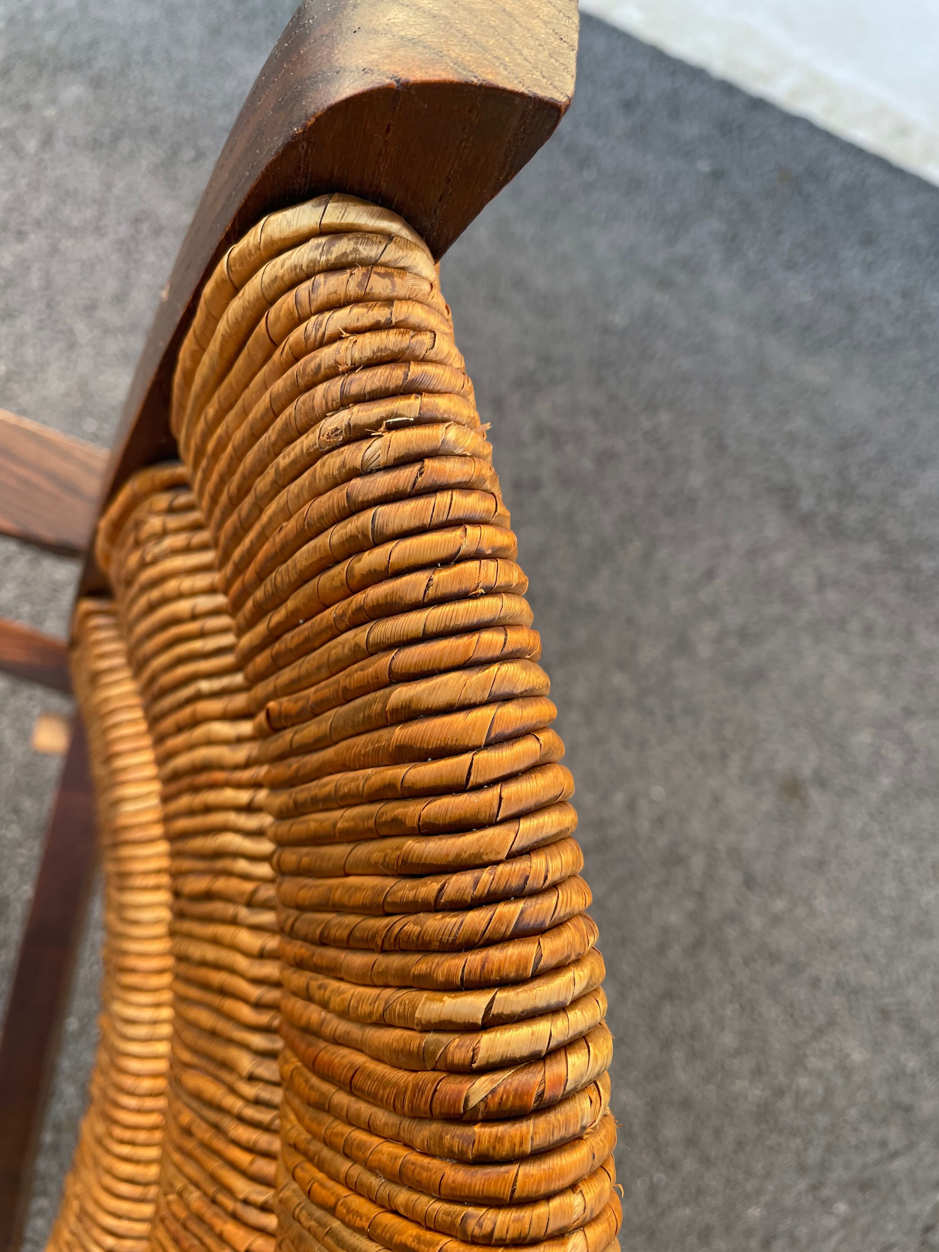 Vintage armchair in straw and brutalist wood