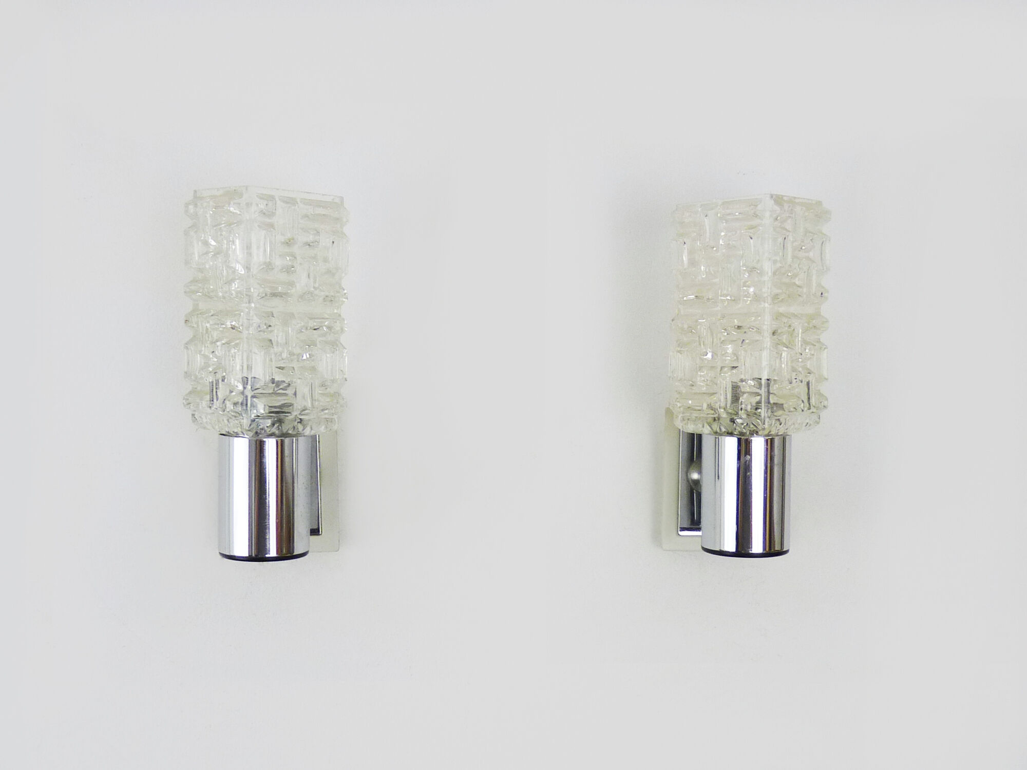 Pair of space age wall sconces, stainless steel and thick glass, 60s 70s