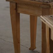A pair of antique Danish pine stools from the late 19th century.