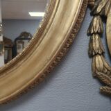 Miroir ovale en bois doré 93x73cm