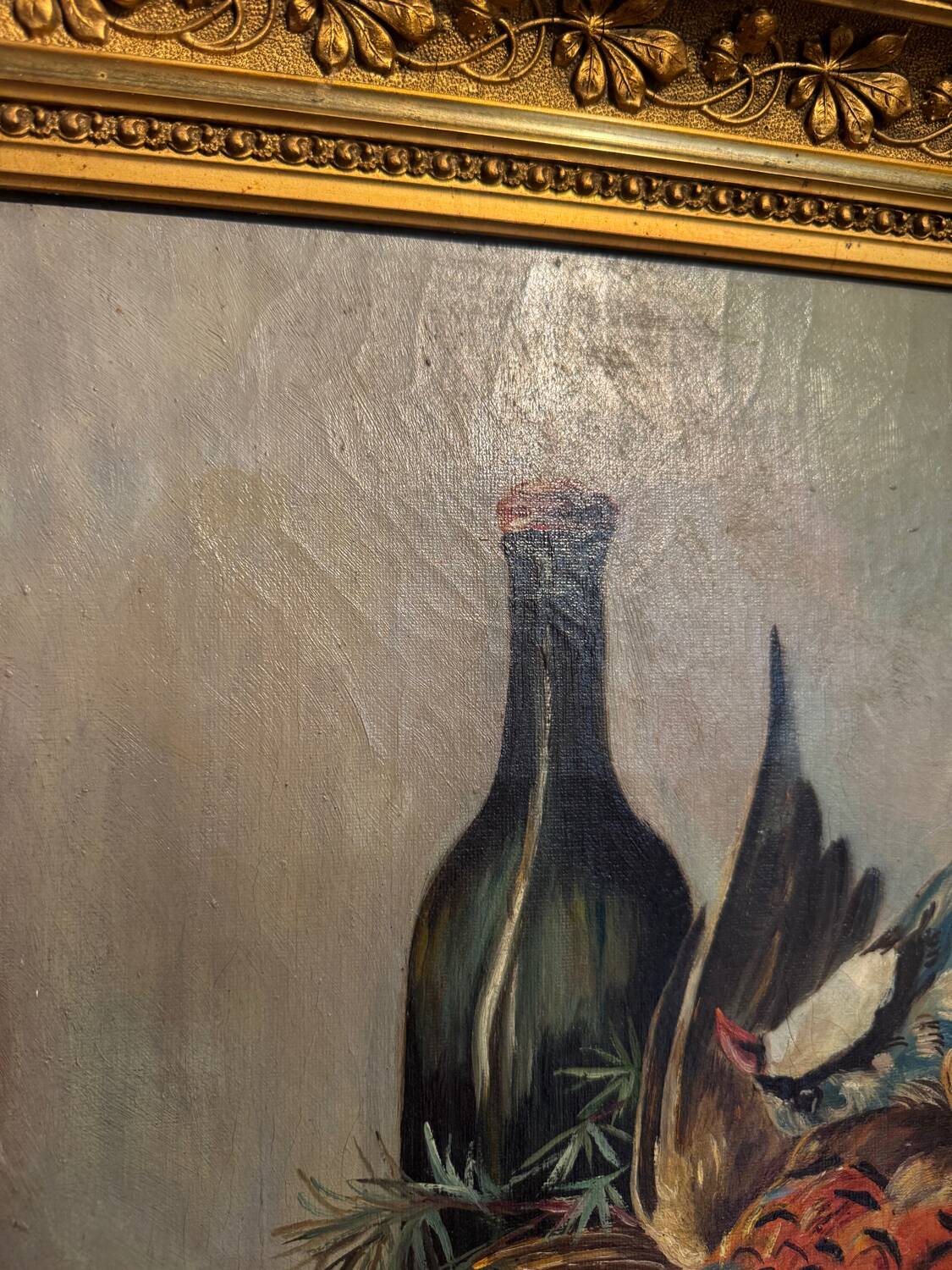 Still life with bottle and game, signed, 20th century