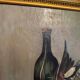Still life with bottle and game, signed, 20th century