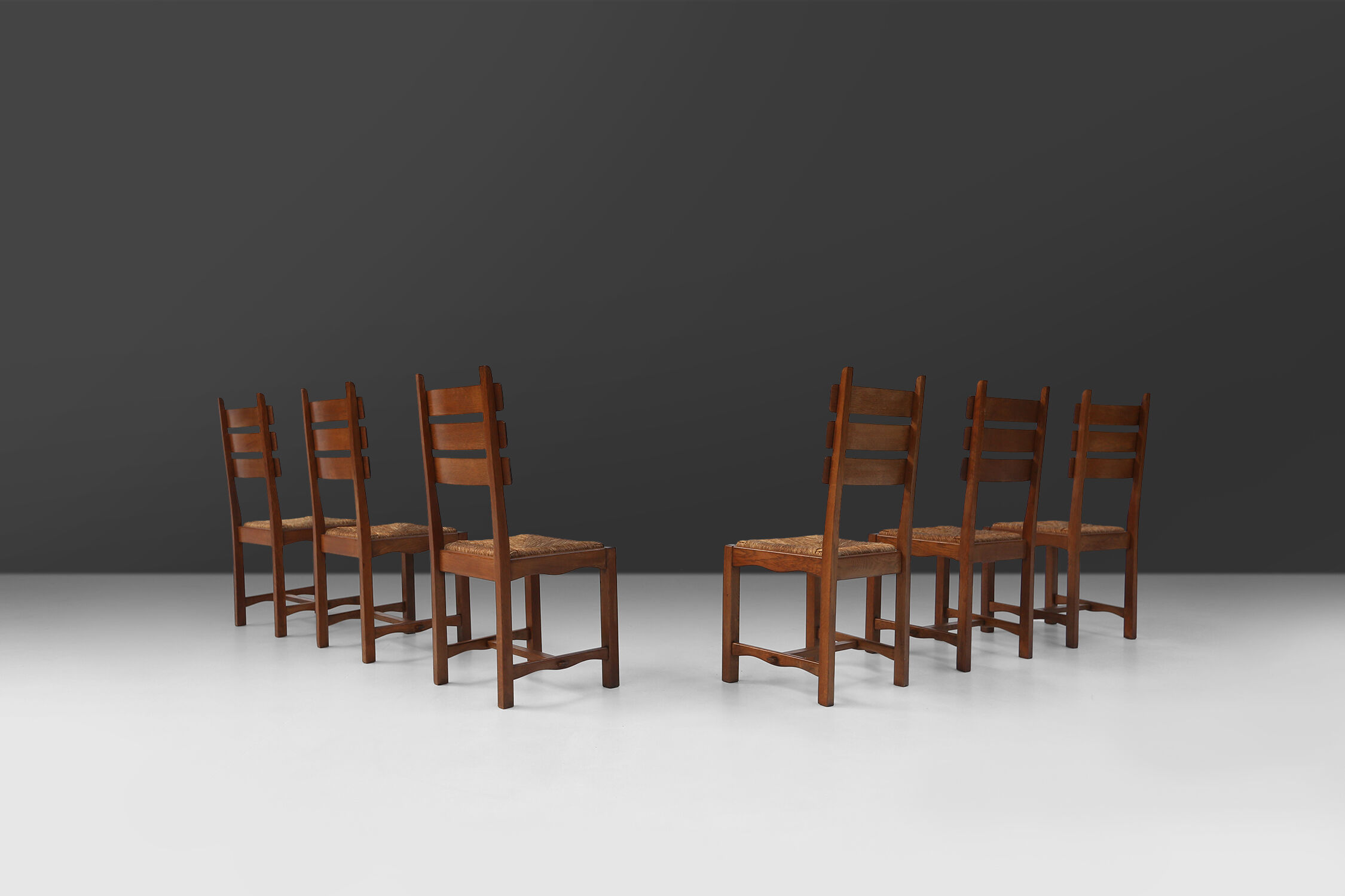 Set of six brutalist dining chairs in oak an wicker