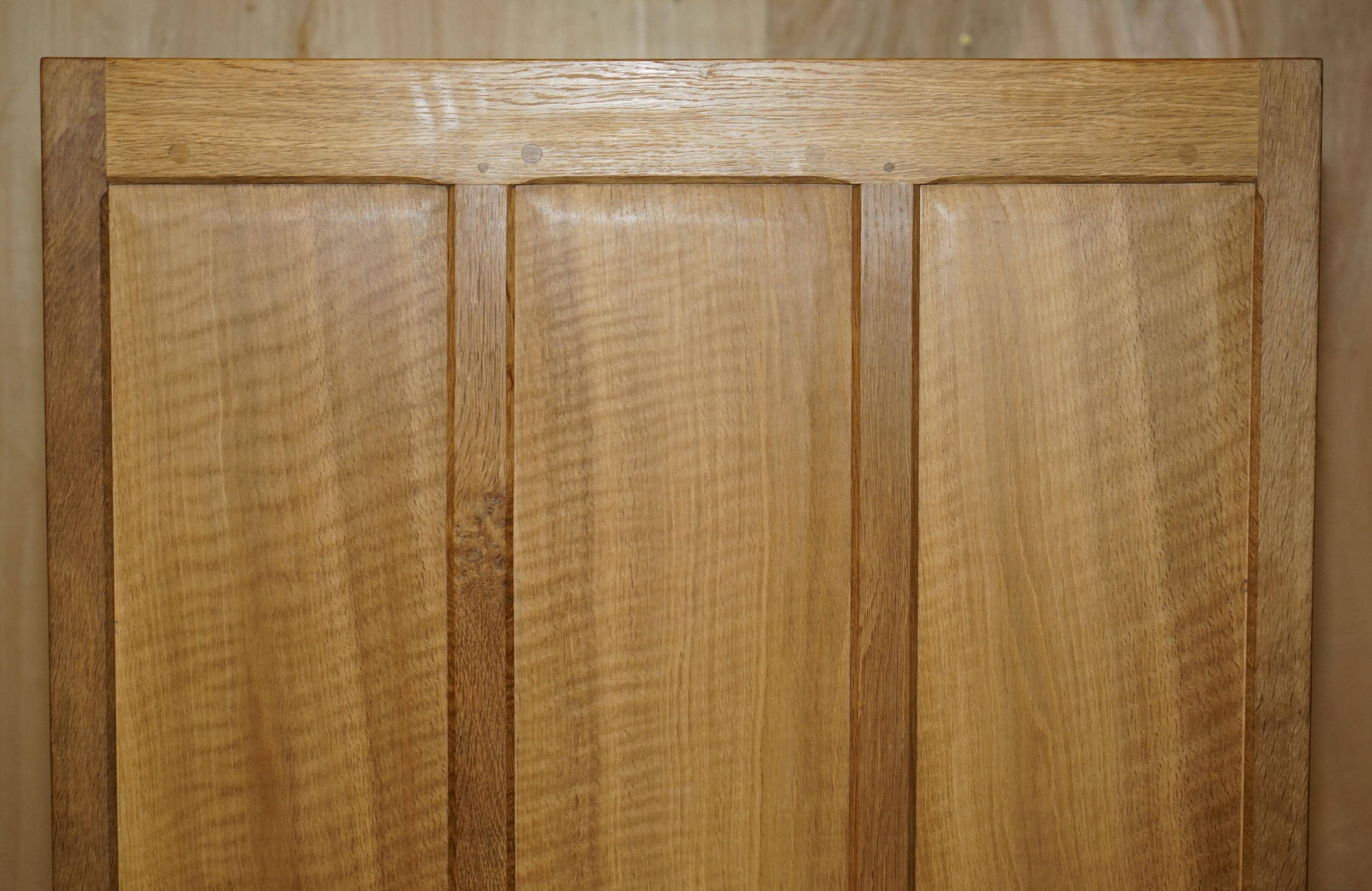 Pair of Robert Mouseman Thompson oak carved bookshelves.