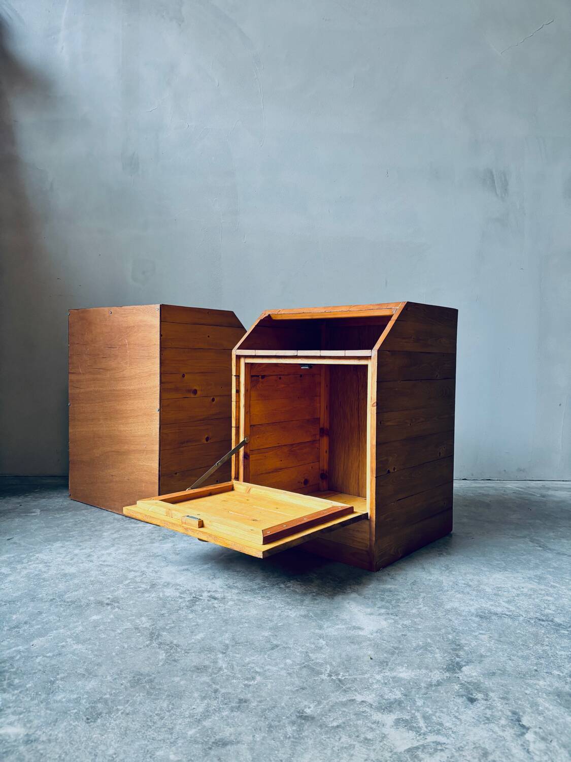 Pair of handcrafted solid wood bedside tables with drop-down doors.