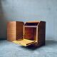 Pair of handcrafted solid wood bedside tables with drop-down doors.