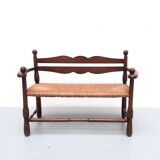 Vintage bench with wooden backrest and structure and mulched seat