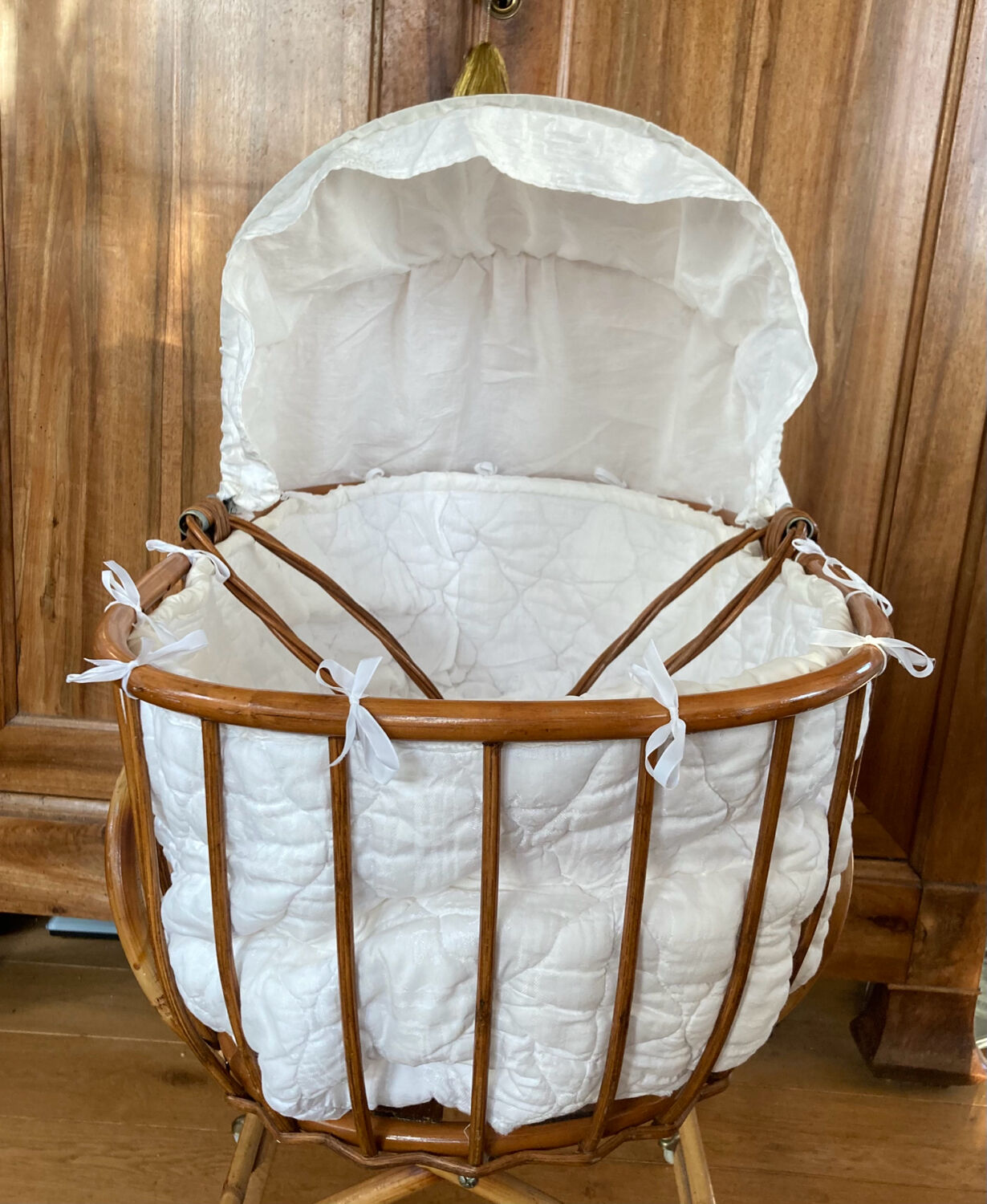 Bamboo, rattan, wicker cradle bassinet from the 1960s with a foldable support.