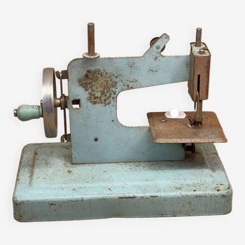 Small blue sewing machine