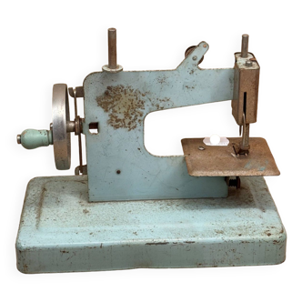 Small blue sewing machine