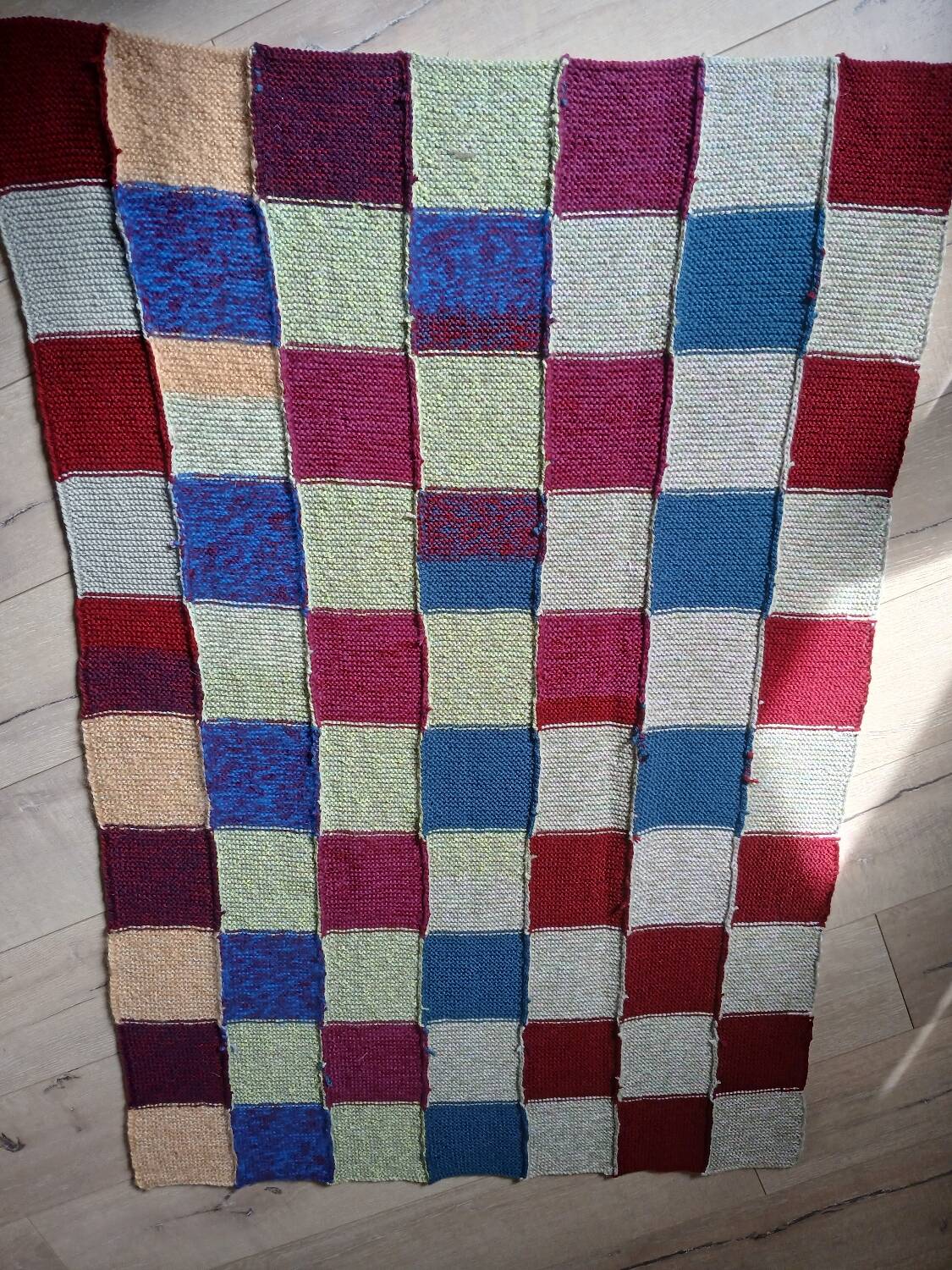 Hand knitted patchwork plaid
