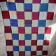 Hand knitted patchwork plaid