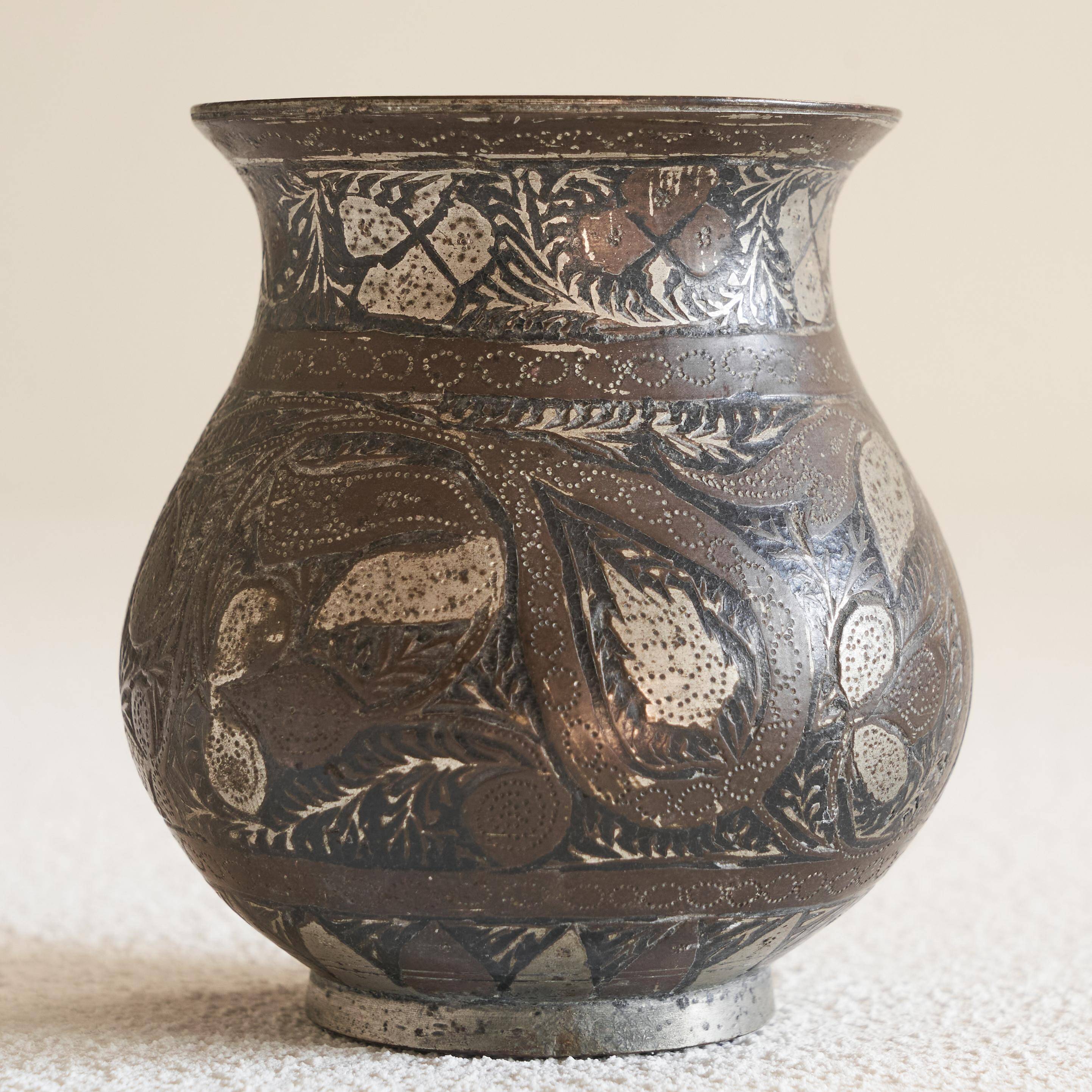 Antique pyriform Bidri vase in the shape of a pyramid.