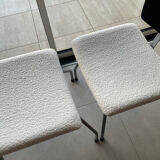 Armchair and footrest in boucle wool.