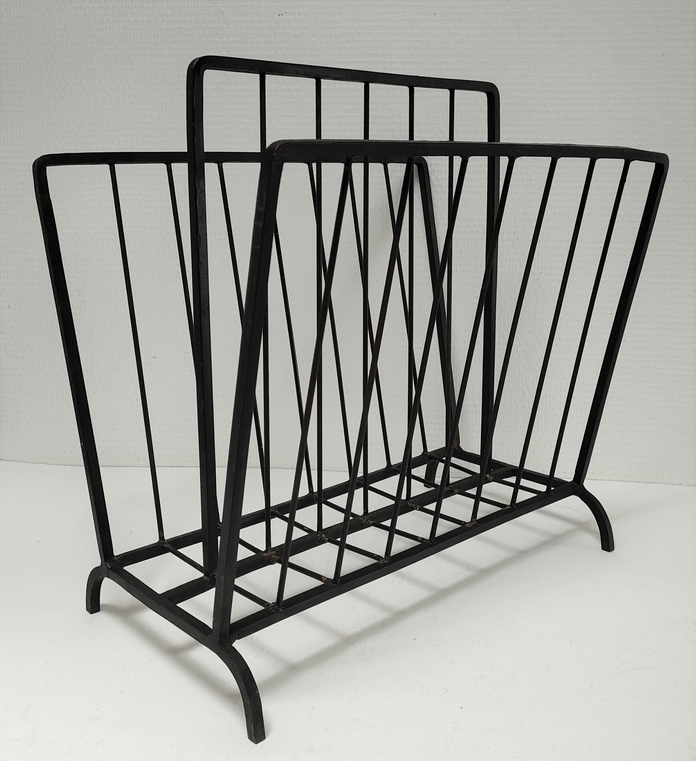 Modernist magazine holder black iron 60s