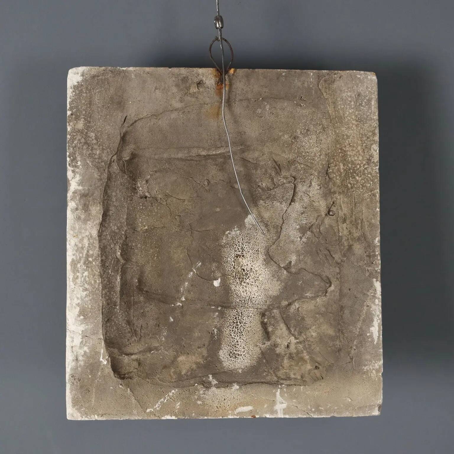 Old plaster tile with a fierce mask decoration, Italy, 19th century.