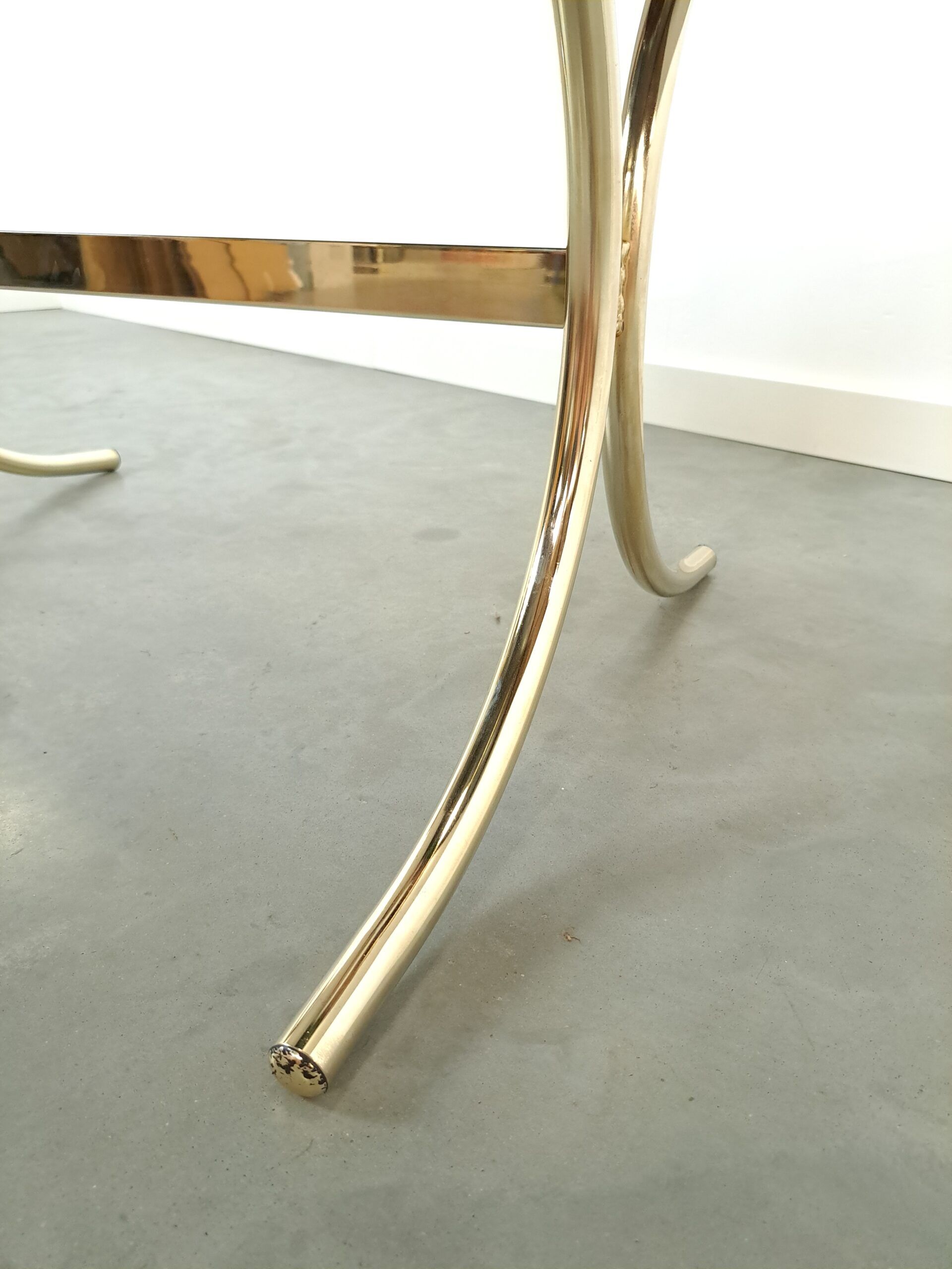 Smoked glass coffee table with gold-coloured legs from Sweden
