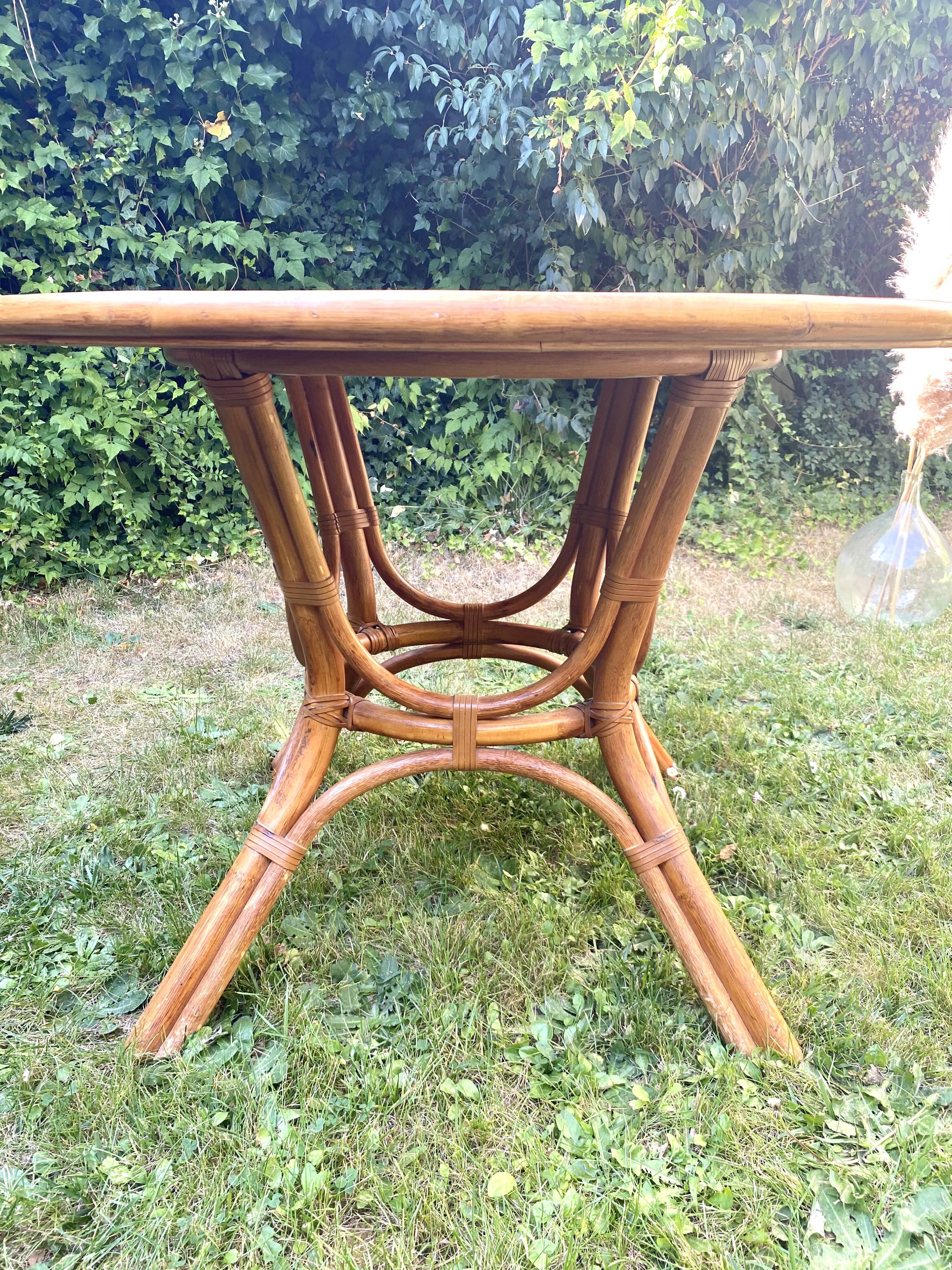 Canned rattan dining table and vintage glass