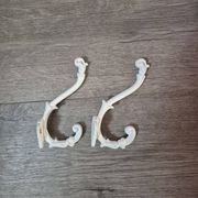 set of 2 vintage white cast iron hooks, small paint chips from the year