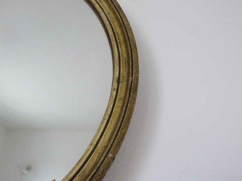 Old oval mirror in gilded wood 50s 60s