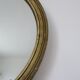 Old oval mirror in gilded wood 50s 60s