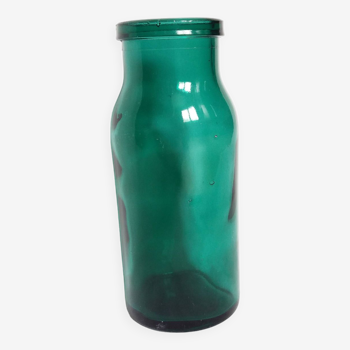 Emerald green molded glass bottle jar
