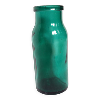 Emerald green molded glass bottle jar