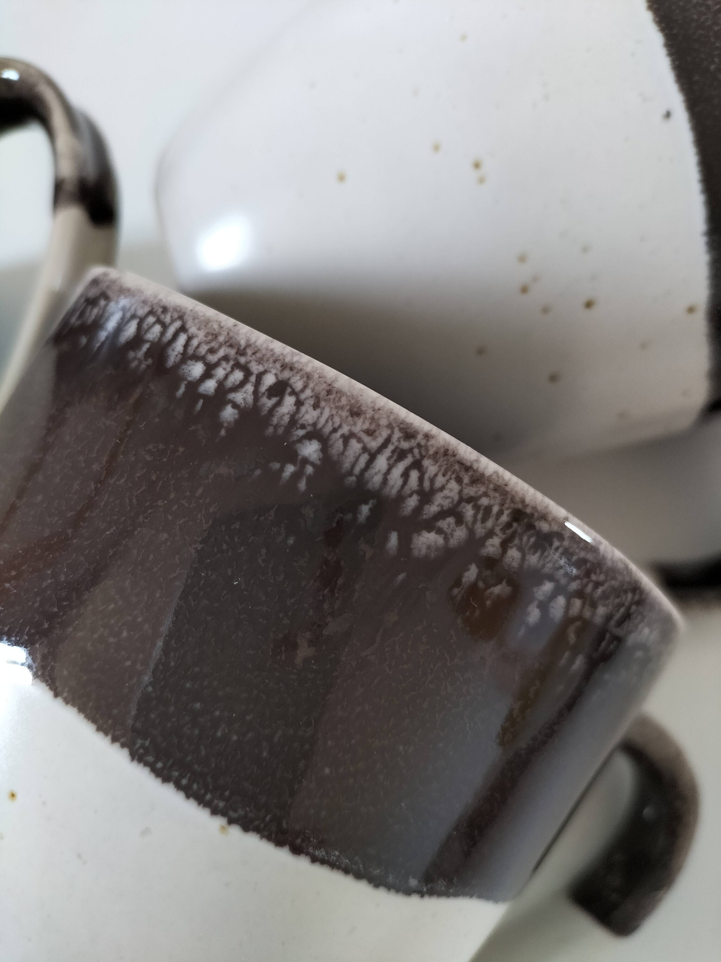 Set of three two-tone mugs, glazed stoneware, café workshop style.
