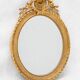 Pair of 19th century French oval gold leaf mirrors