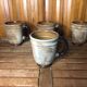 Set of 4 beige ceramic mugs fleur de lys vintage