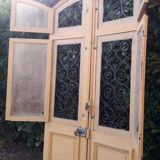 Porte d'entrée cintrée double en chêne, grilles et verre, XIXème