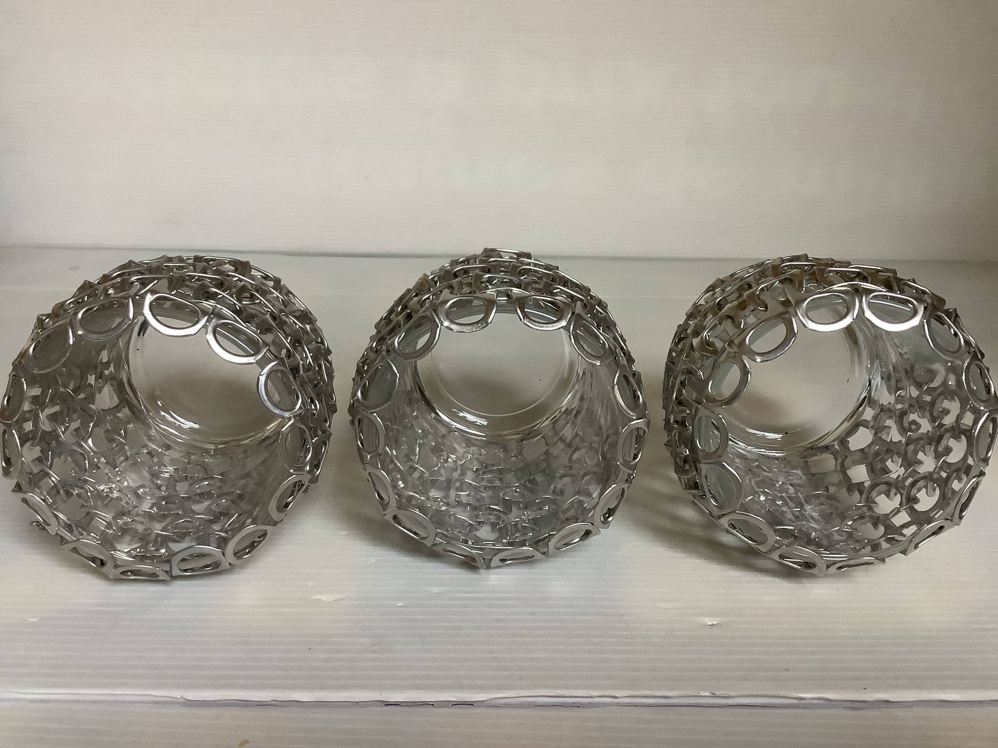 Trio of candle holders in metal strips folk art