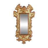 Larch wood mirror, carved and gilded.