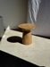 Natural solid mango side table (monoxyle) with conical base.