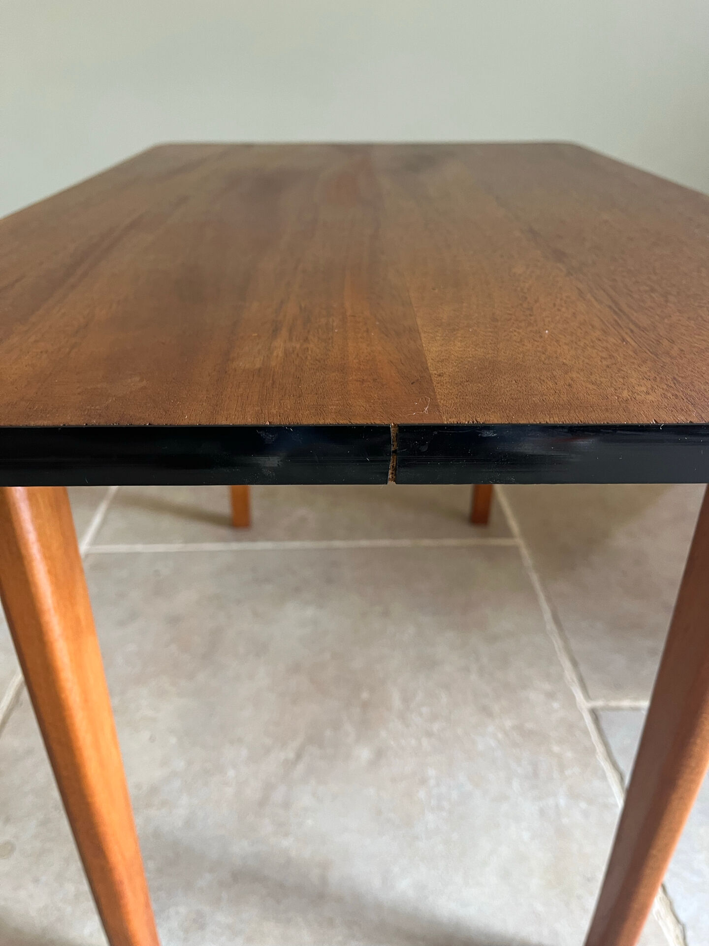 Mid-century coffee table with tapered legs.