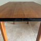 Mid-century coffee table with tapered legs.