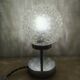 Duo of textured globe lamps with a large play of light.
