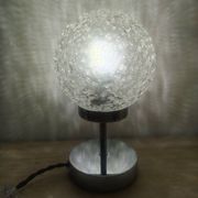 Duo of textured globe lamps with a large play of light.