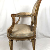 Carved and gilded wooden armchair in Louis XVI style, circa 1900