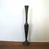 Stylized vase in engraved metal
