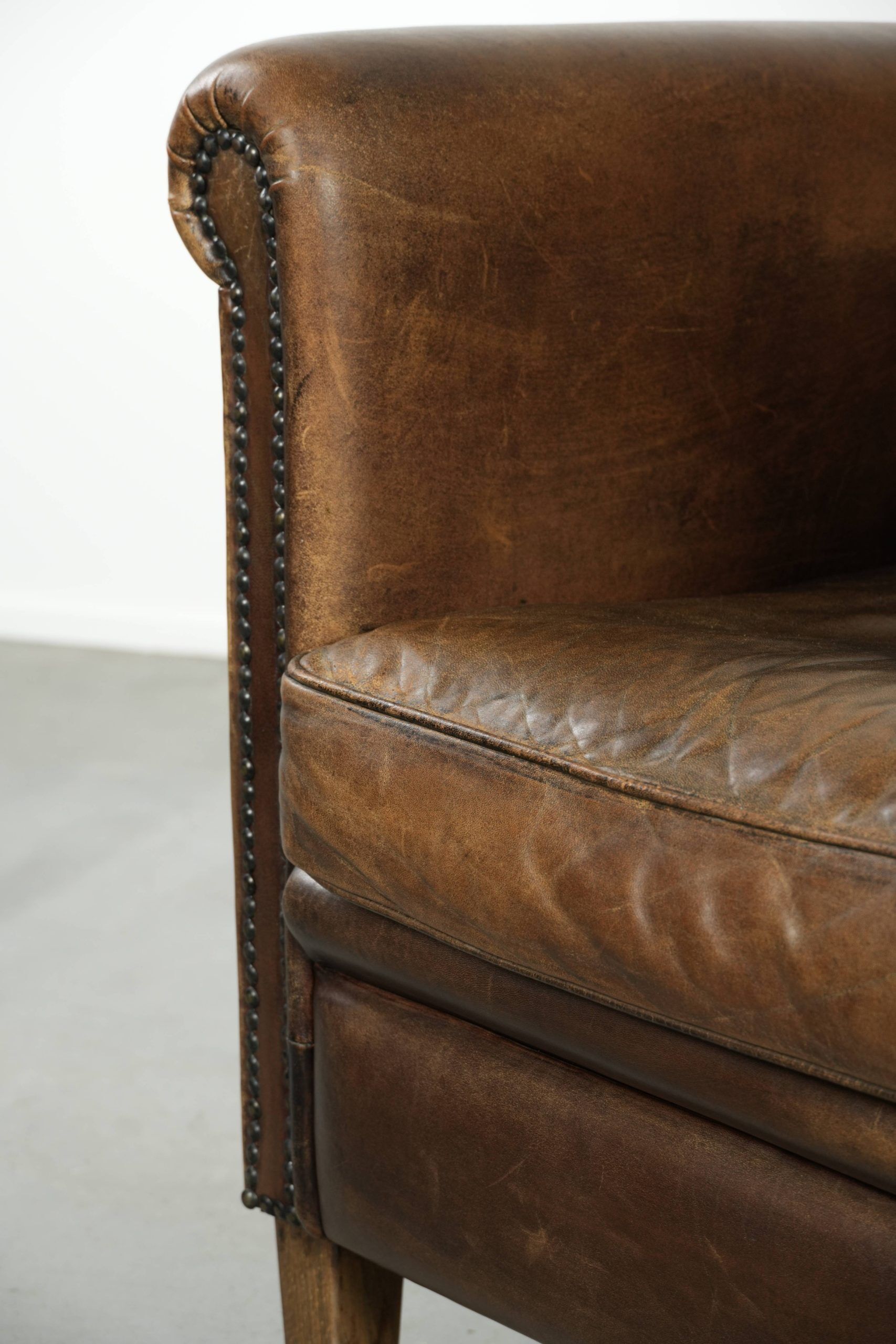Characterful sheepskin design armchair with beautiful patina