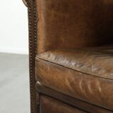Characterful sheepskin design armchair with beautiful patina